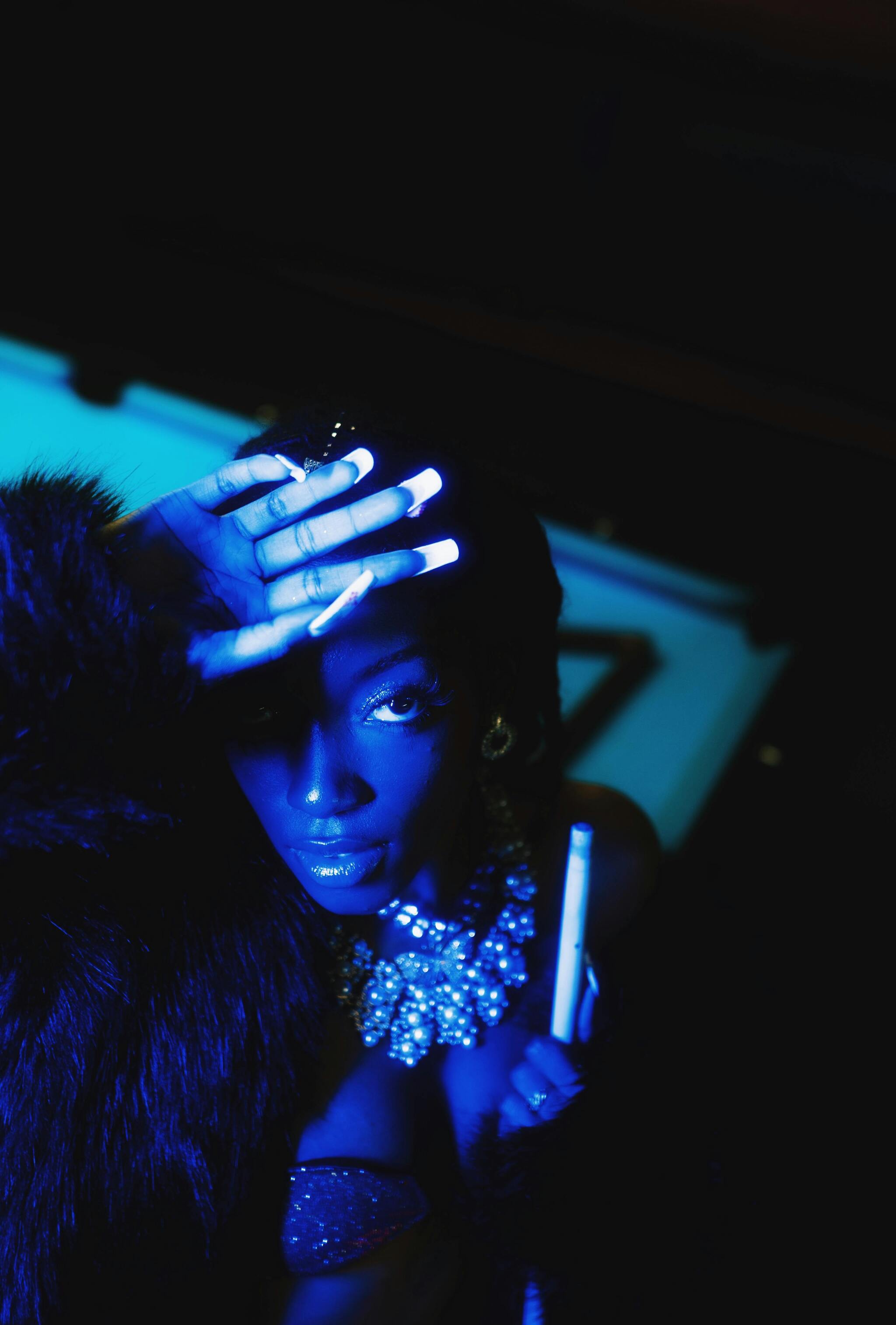 Dramatic portrait in blue light showcasing Daydream camera app's film simulation capabilities